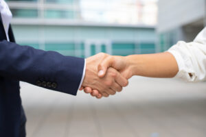 closeup-shot-of-business-handshake-cropped-shot-of-two-people-wearing-formal-suits-shaking-hands-business-handshake-concept